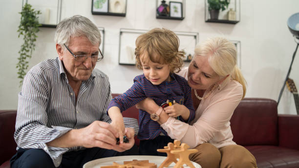 grandparents spend time with their grandchildren at home