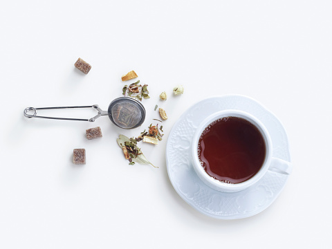 A cup of herbal tea top view. on a white background
