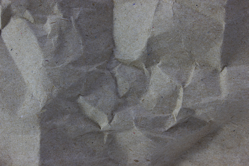 Background texture of kraft paper. A crumpled sheet of wrapping paper.