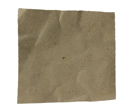 Square pile of kraft paper isolated on white background.