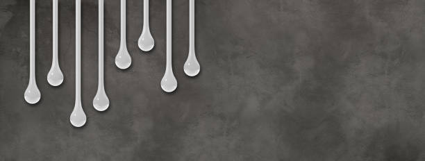 istock White ink drops on dark concrete wall. Horizontal banner 1479267406
