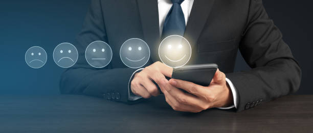istock Man holding smartphone device and touching screen with five star rating feedback 1479267508