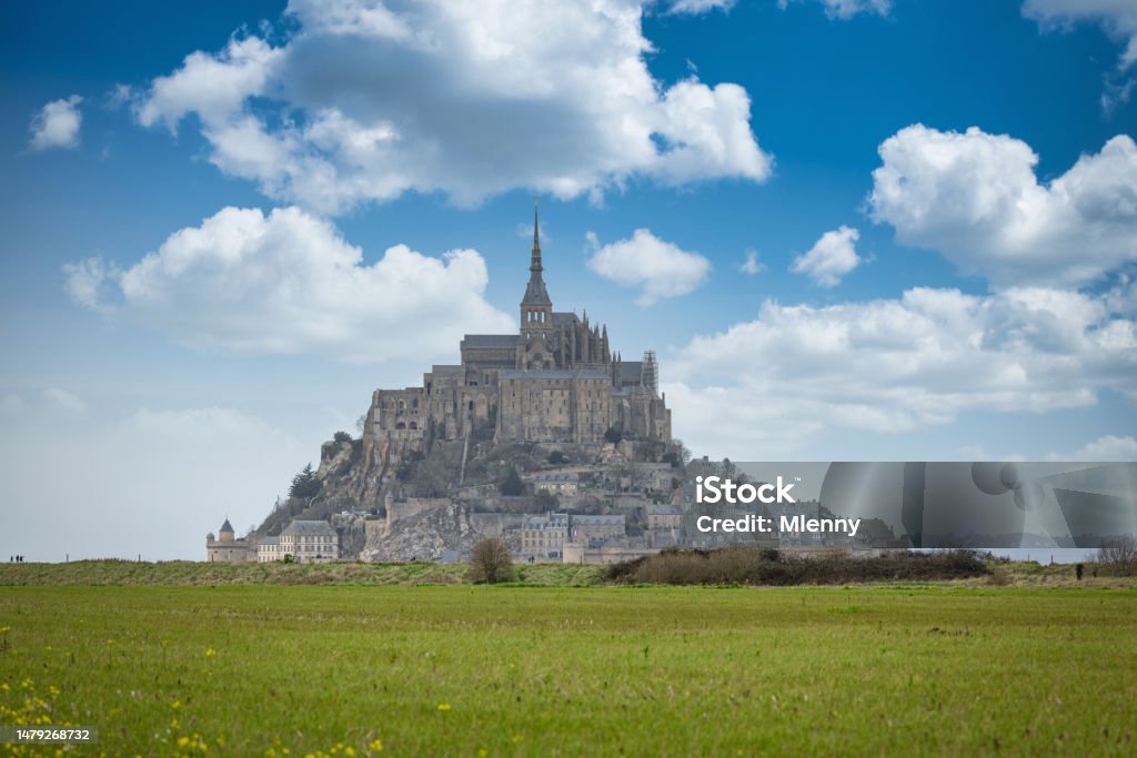 Mont Saint-Michel Normandy France in Summer Mont Saint-Michel on tidal Island under sunny summer skyscape. View from the normandy land side towards Mont Saint Michel at the Normandy Coast. Mont Saint-Michel, Avranches, Manche, Normandy, France, Europe Avranches Stock Photo