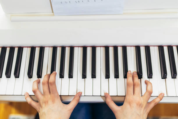 istock Child practicing on the modern electric piano at home. 1479271519