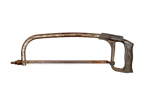 An old hacksaw on metal on a white background. Rusty hacksaw on metal.