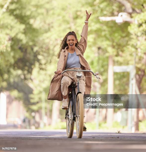 Happy Black Woman Bike And Cycling In The Park For Fun Holiday Break Weekend Or Travel In The Outdoors African American Female Smiling In Happiness And Enjoying Bicycle Ride Traveling Or Freedom Stock Photo - Download Image Now
