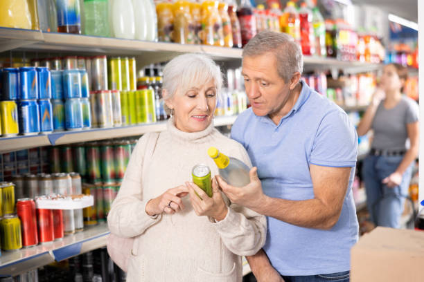 istock Aged woman and man choosing soft drinks in grocery store 1479281096
