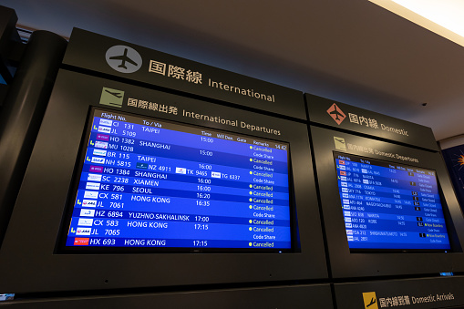 Chitose, Japan - August 20, 2022 : Flight information board display cancelled international flights at the New Chitose Airport in Hokkaido, Japan.