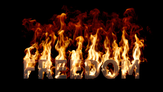 Big Freedom Word on Fire with High Flames on a Black Background