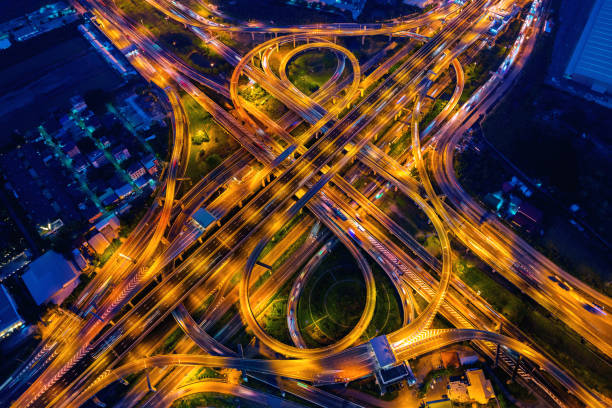 istock Aerial view of traffic on massive highway intersection at night. 1479283935
