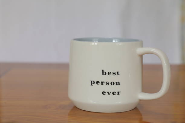 istock A white cup that says best person ever on it. 1479286061