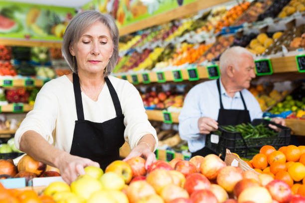 istock Mature greengrocer workers in salesroom 1479286478