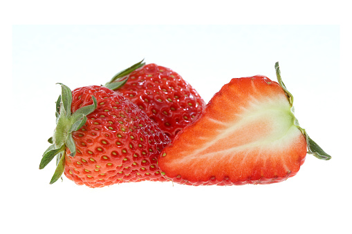Dissected strawberry on white background