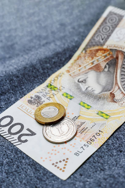 istock Two Polish coins and a banknote on a gray background 1479303223