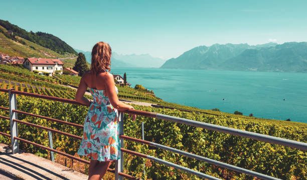 Woman looking at panoramic view of Genova lake in Switzerland Woman looking at panoramic view of Genova lake in Switzerland geneva switzerland stock pictures, royalty-free photos & images