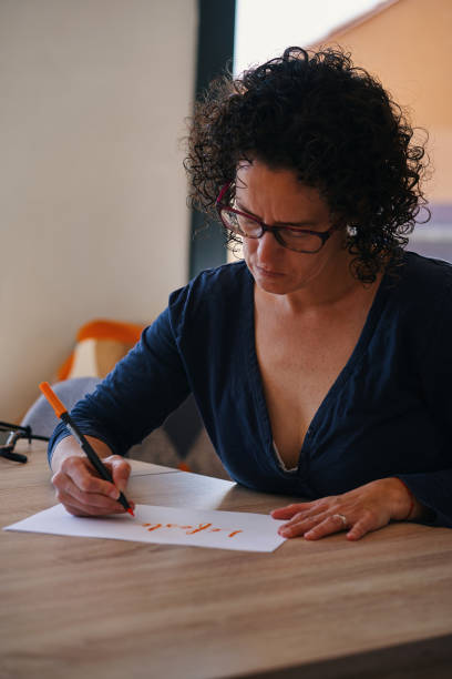 istock woman doing lettering, lifestyle, 1479303791