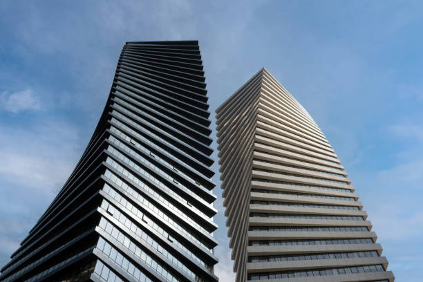 istock Bottom view. Two beautiful modern office skyscrapers against the sky. 1479305641