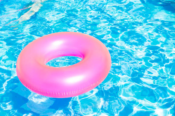 istock Colorful Inflatable Swimming Ring floating in the pool 1479307237