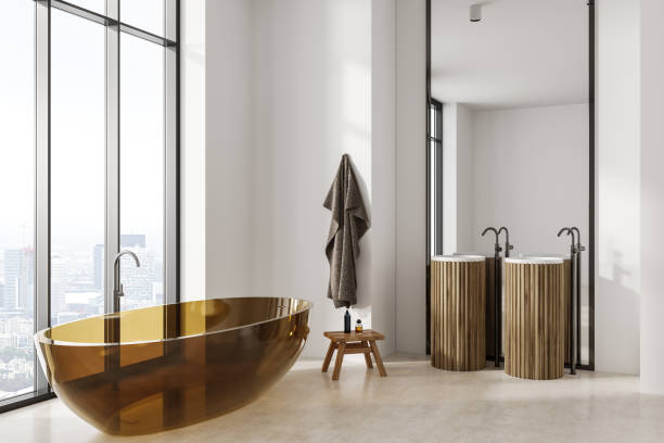 istock Panoramic white bathroom with transparent tub 1479309827
