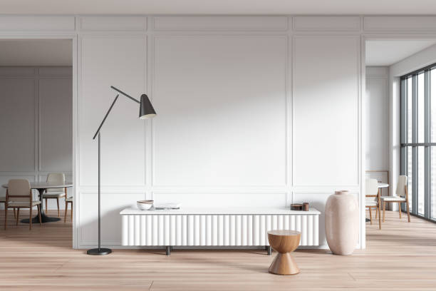 istock Stylish living room interior with drawer and dining table. Empty wall 1479309974