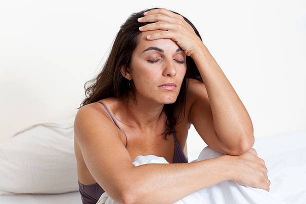 istock Beautiful woman suffering from headache 147931051