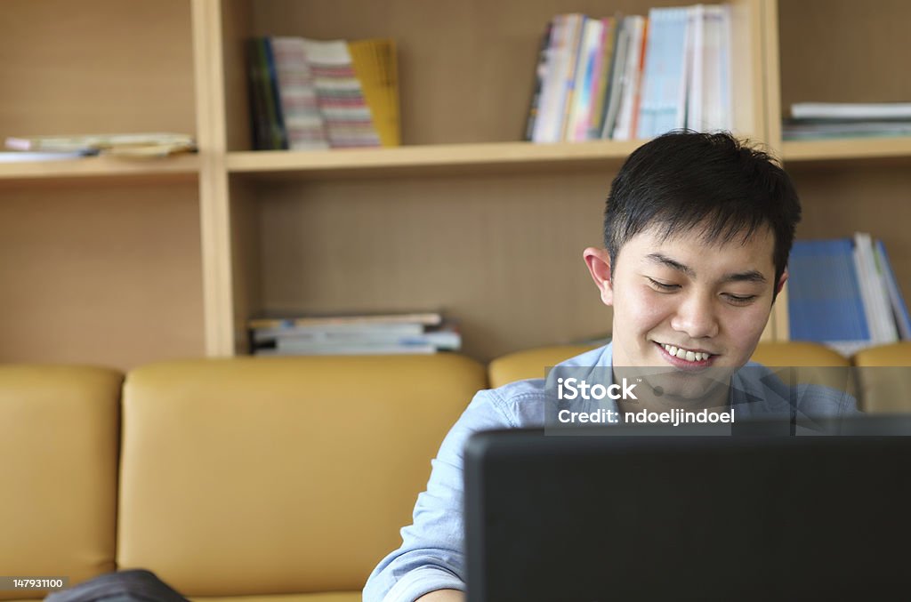 college student with laptop college student with laptop indoor and smiling Book Stock Photo