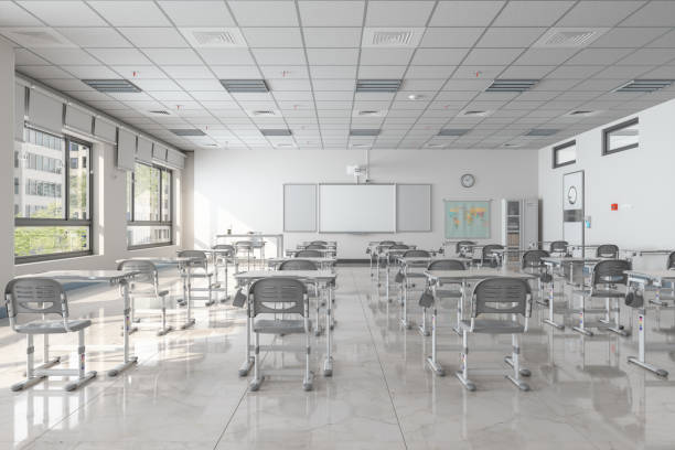 Interior Of An Empty Modern Classroom With Desks, Chairs And Whiteboard. Digital image of Classroom.