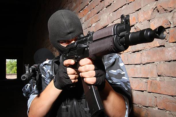 istock Terrorists in black masks with guns 147931218