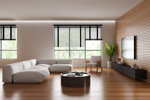 istock Stylish relaxing interior with couch and tv screen, drawer and panoramic window 1479313147