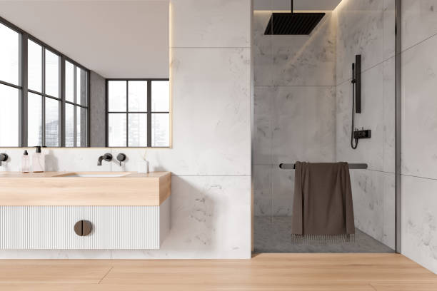 istock White marble bathroom with double sink and shower 1479313630