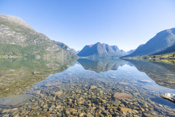 Free picture: Reflection of mountain on calm water surface