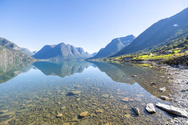 istock Spectacular mountain and lake landscape in Norway, reflection on water surface 1479313995