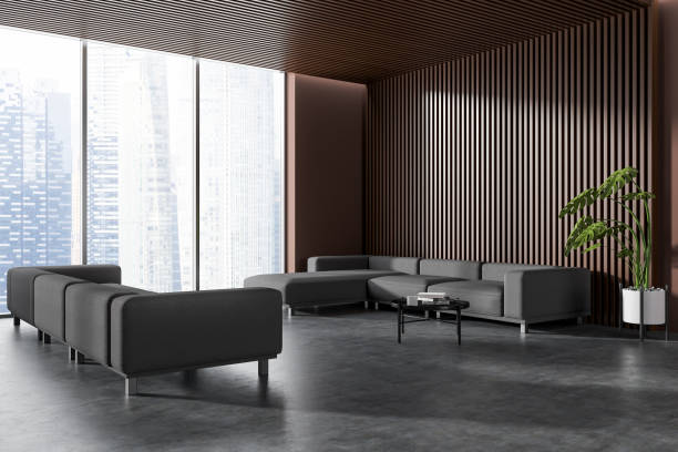 istock Corner view on dark meeting room interior with two sofa 1479314147