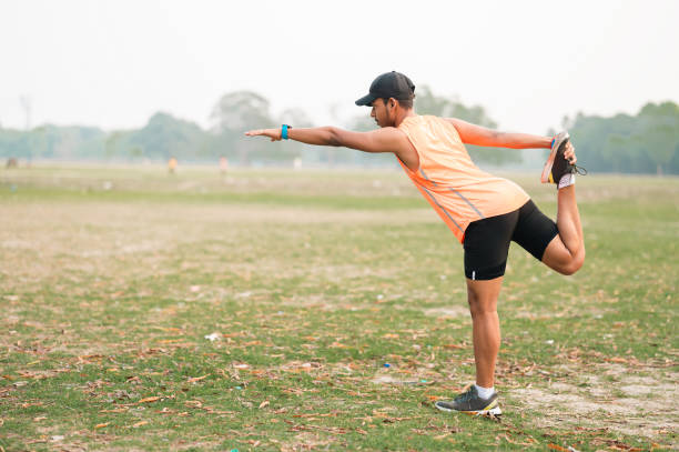 istock Young man doing lord of dance pose or stretching his body while doing morning exercise 1479314348