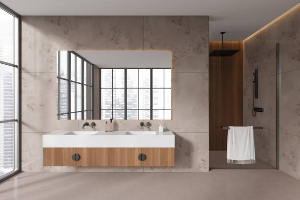 istock Beige bathroom interior with double sink and douche, panoramic window 1479314393