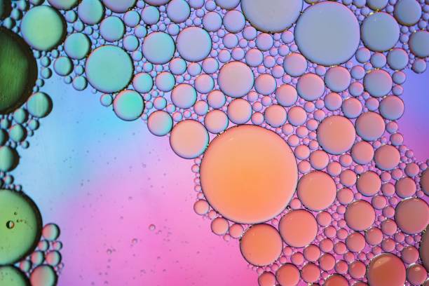 istock multi colored oil circles on the water, colorful background 1479316701