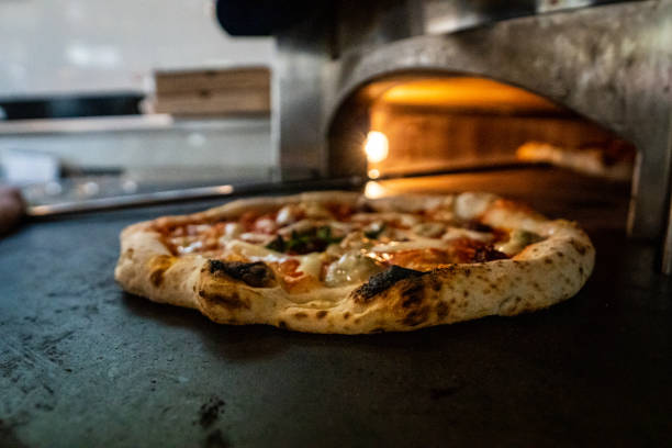 istock pizza chef preparing raw dough pizza olive oil basil mozarella fresh italian style napoletana napoli pizza about to be in oven 1479317618