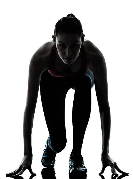 istock woman sprinter on starting block 147931780