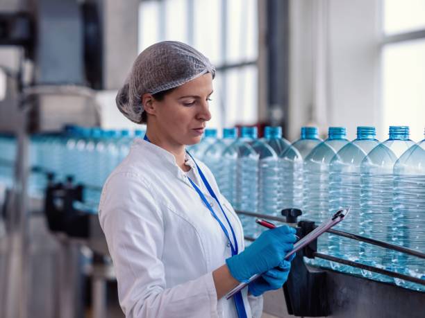 istock Female engineer working on maintenance in bottling plant 1479321868