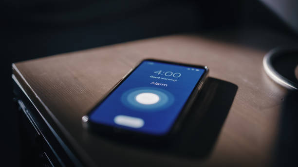 istock Smartphone Alarm Clock App Rings for Wake up, Screen Shows 1479324456