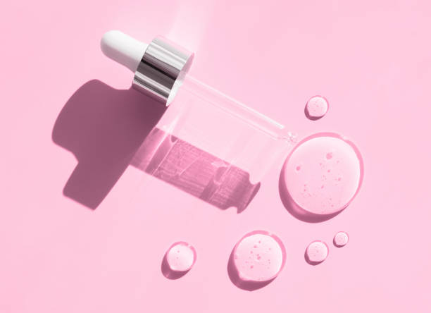 istock pipette drop of serum test on a pink background 1479325482