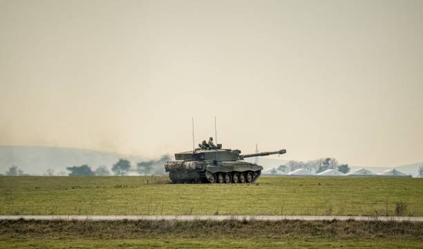 istock Challenger commander and gunner directing a main battle tank 1479327385