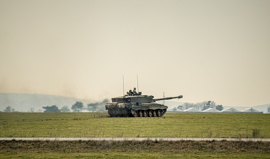 army tank in action on a military exercise