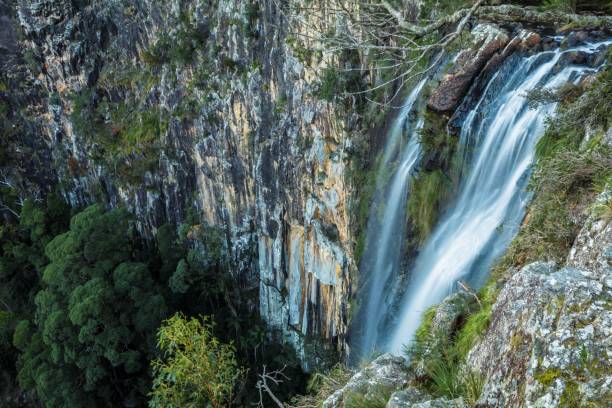 istock Stunning landscape featuring a powerful waterfall cascading down the side of a rocky cliff. 1479328076