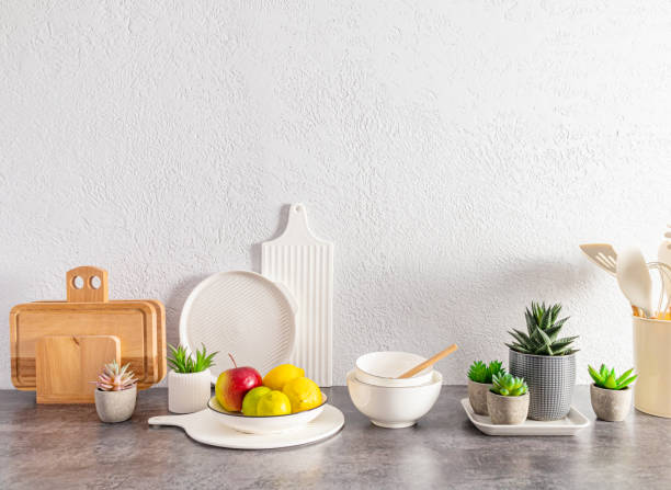 istock Beautiful kitchen background with a set of various environmentally friendly dishes, cutting boards, fruits in a bowl. space for text. 1479331182