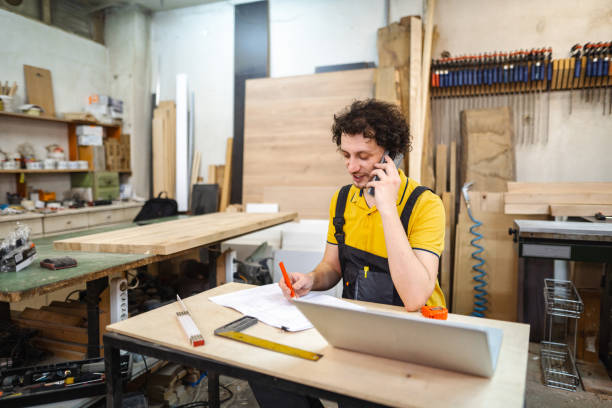 istock Craftsman writing down order details at the woodshop 1479332377