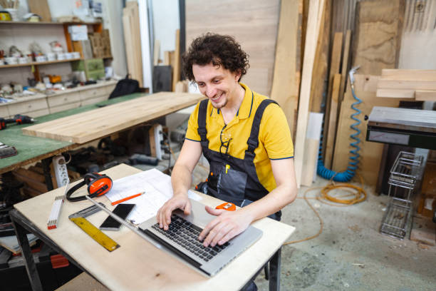 istock Craftsman working on administration paperwork at the woodshop 1479332451