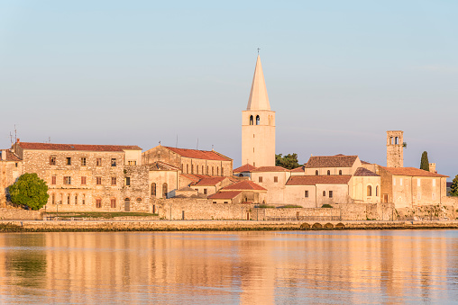 Porec (Italian: Parenzo) is a town and municipality on the western coast of the Istrian peninsula, Croatia.\nPorec is almost 2,000 years old, and is set around a harbor protected from the sea by the small island of Saint Nicholas / San Nicolo.\nThe Euphrasian Basilica, rebuilt in the 6th century under the Byzantine Empire and bishop Euphrasius, is the most important historical site in Porec. It is a protected World Heritage Site, so designated by UNESCO in 1997.\nPorec, Croatia, Europe.