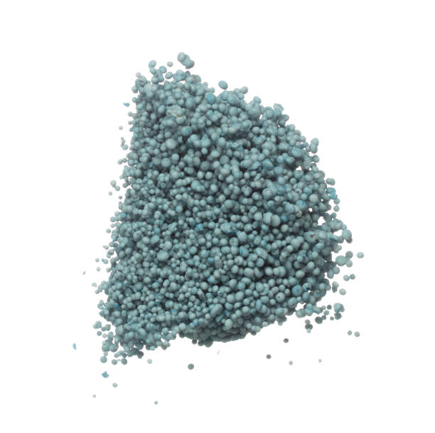 istock Fertilizer blue chemical accelerate growth fly fall explosion, many tiny ball fertilizer for planting float throw in mid air. White background isolated high speed freeze motion 1479335033
