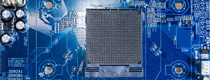 Close up of computer circuit board, electronic components, and chips